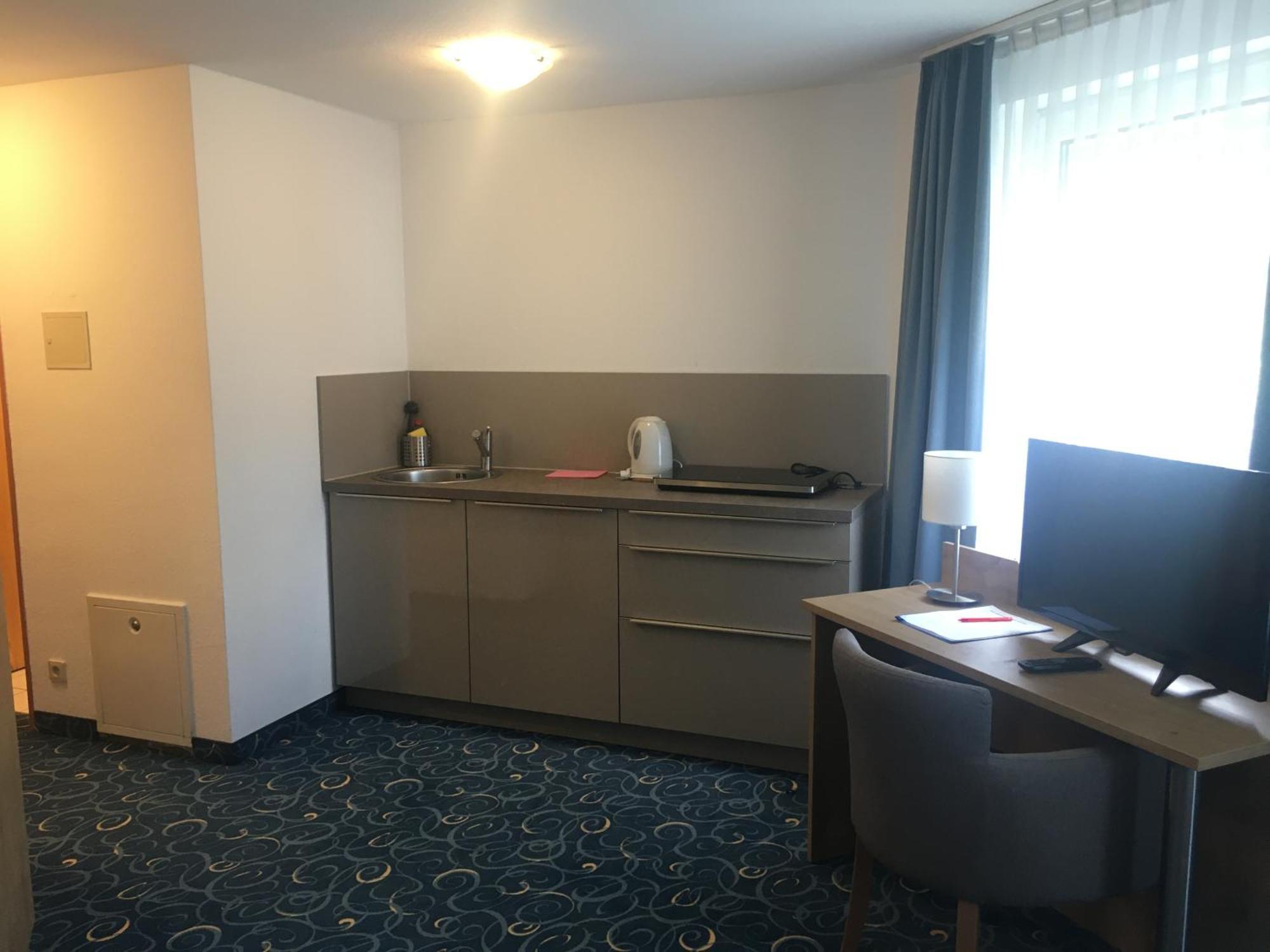 Appartis - Hotel Am Stadtpark ซินเดลฟิงเงน ภายนอก รูปภาพ