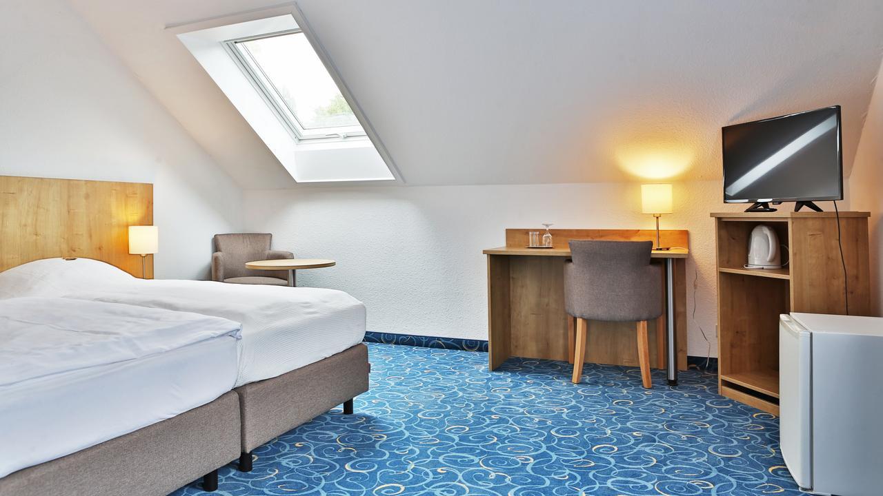 Appartis - Hotel Am Stadtpark ซินเดลฟิงเงน ภายนอก รูปภาพ